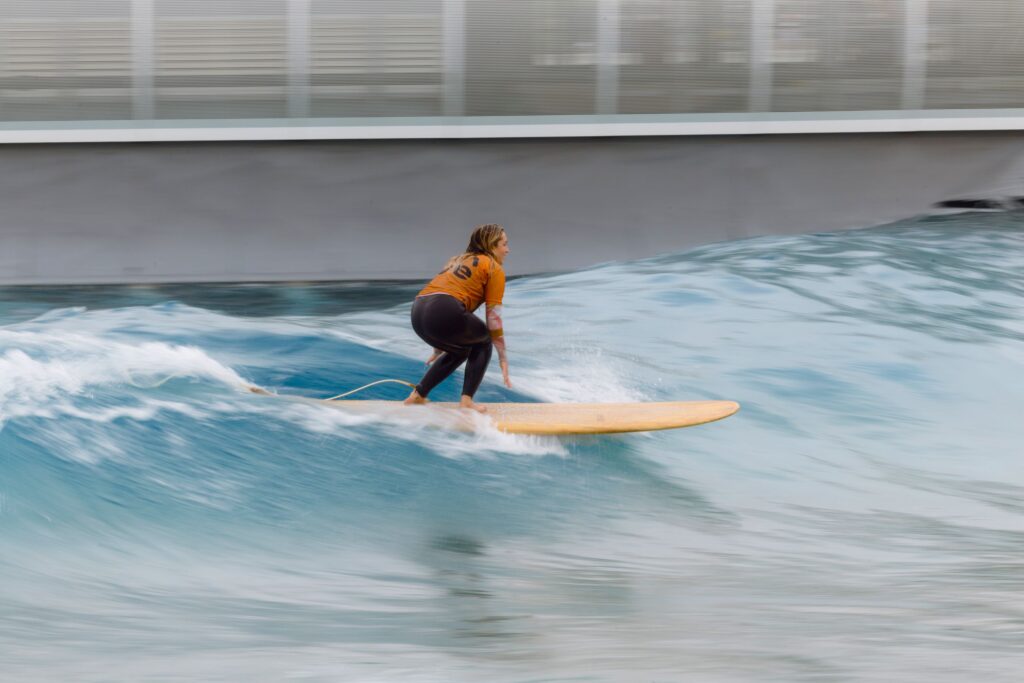 A woman surfs Intermediate at The Wave Bristol.