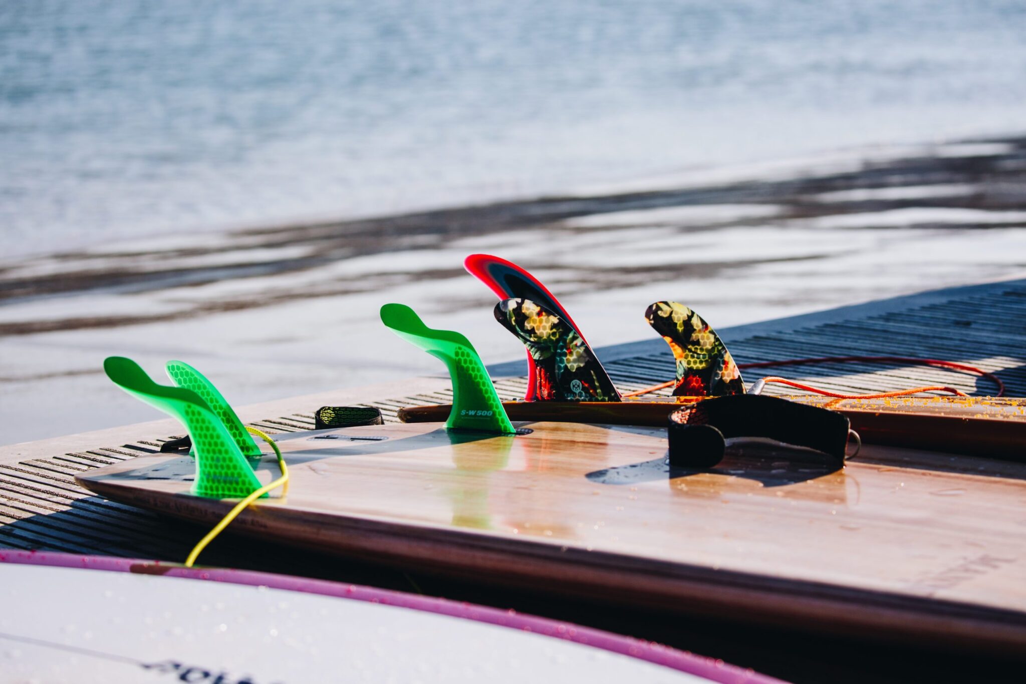 Surfboard fins close-up at The Wave surfing inland lake in Bristol