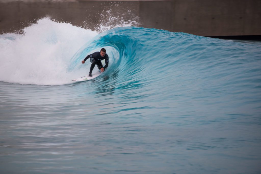 Surfer barrelling at The Wave, inland surfing lake near Bristol