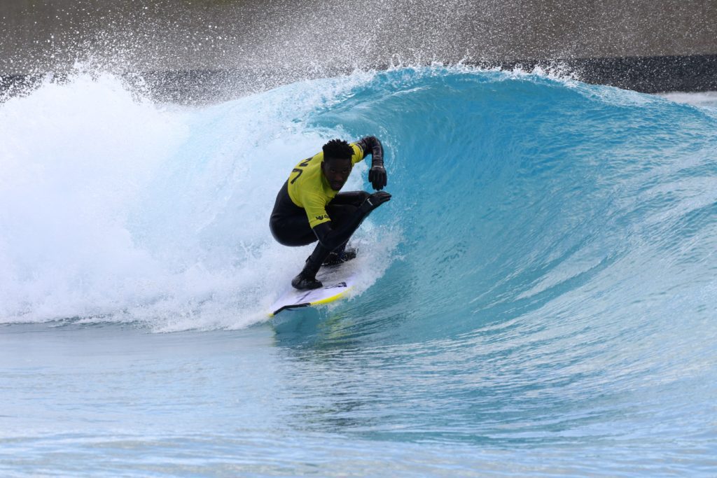 Man surfing reef at The Wave inland surfing lake near Bristol