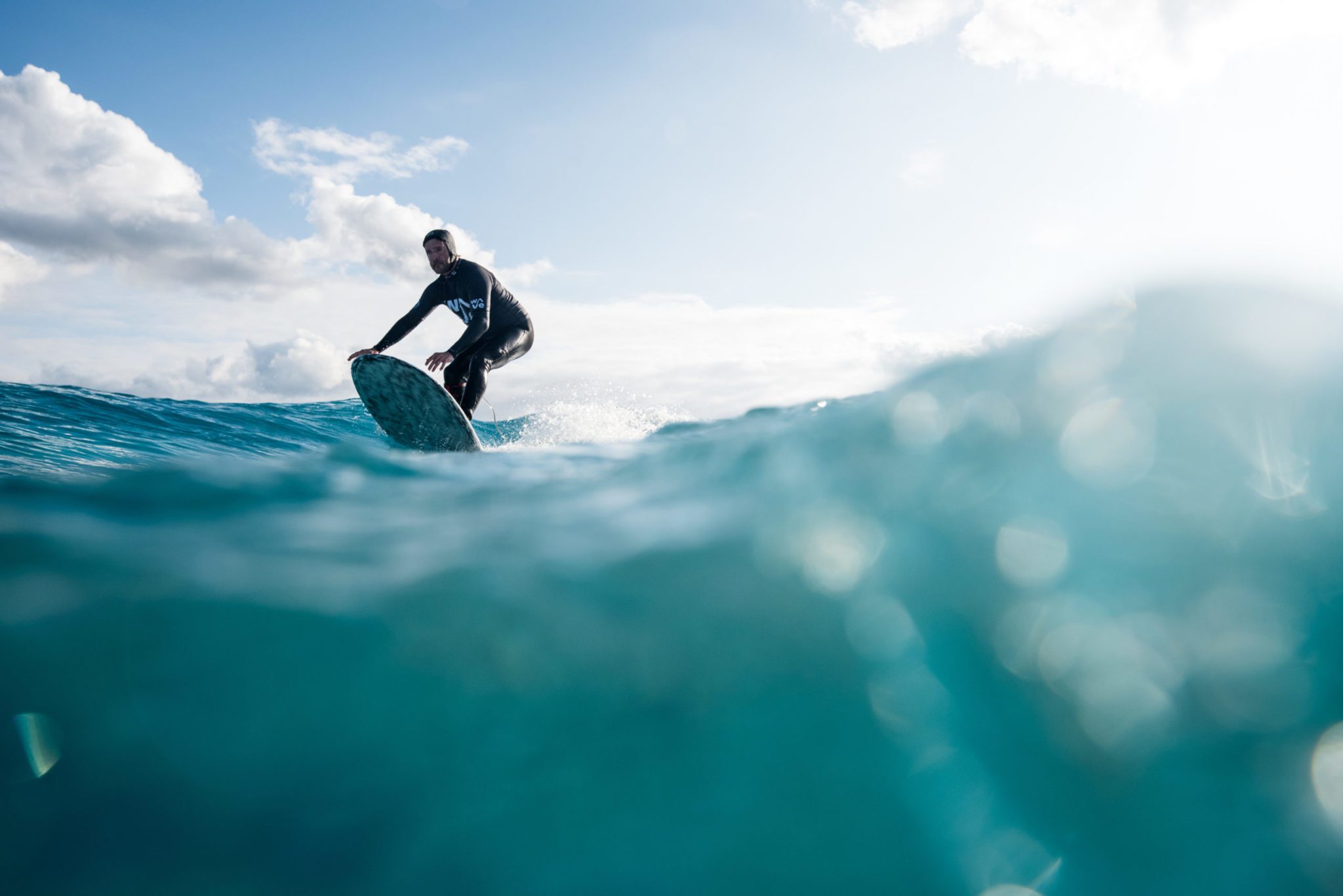 Surfer photograph from underwater at The Wave, surfing inland lake in Bristol