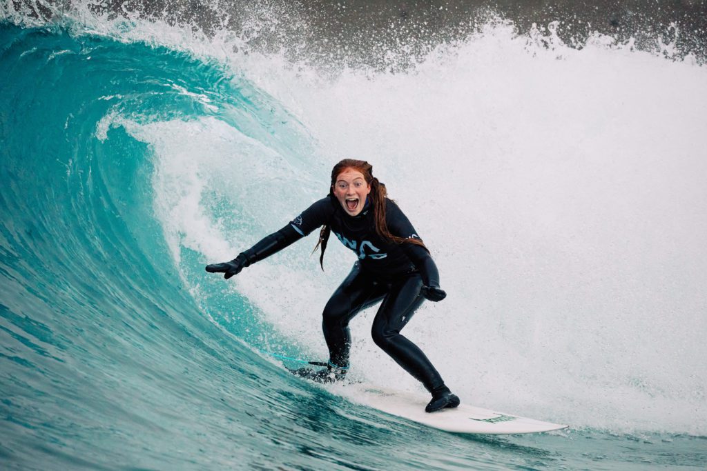 Woman surfer having fun in a barrelling wave at The Wave in Bristol