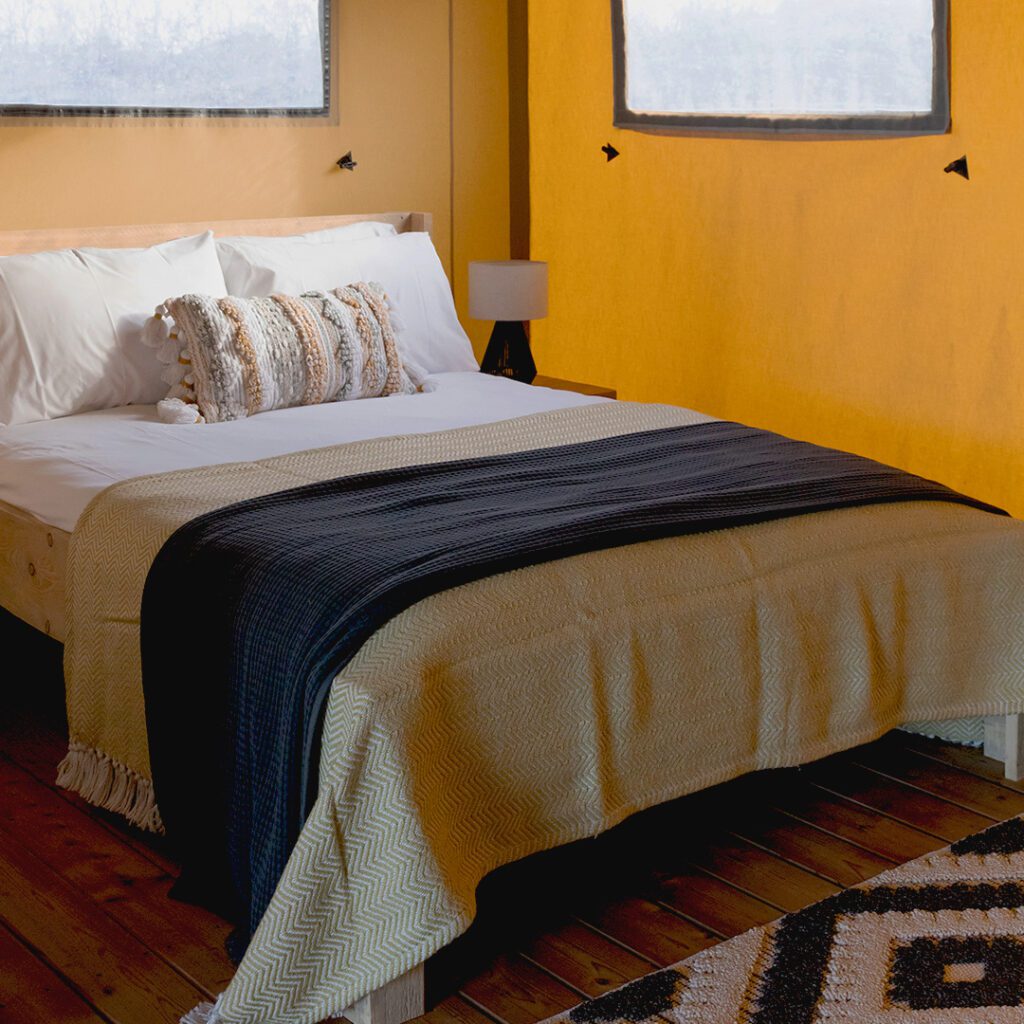 Double bed in Safari tent at The Wave Bristol