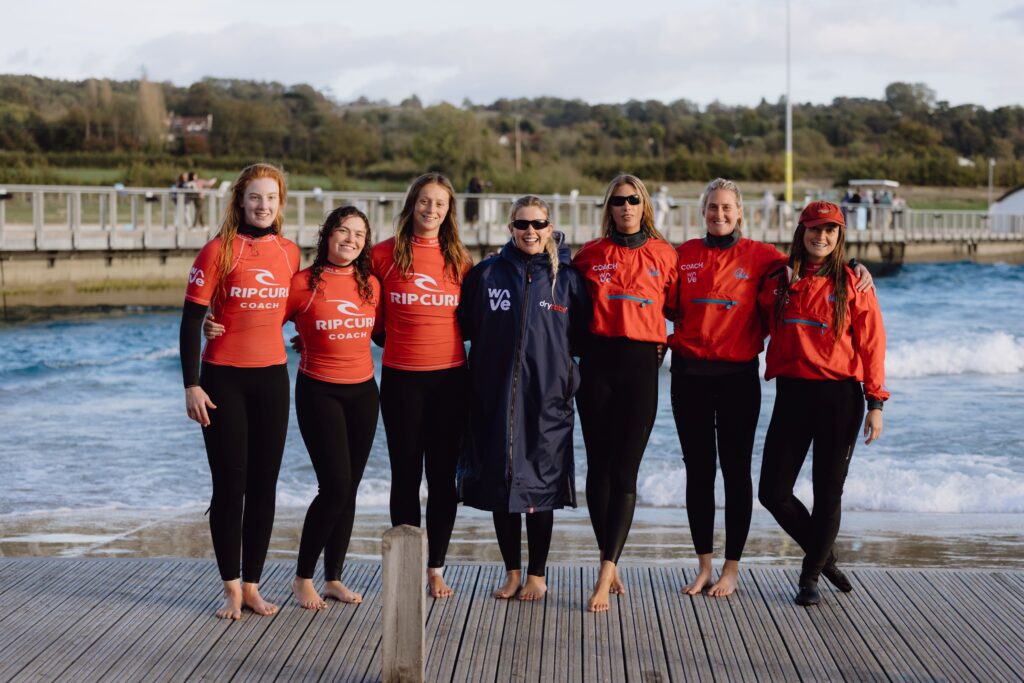 Surf Coaches at The Wave group photo in front of surfing lake