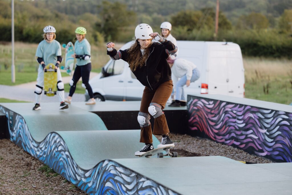 Women skating on a ramp at a Sister Sessions event at The Wave Bristol