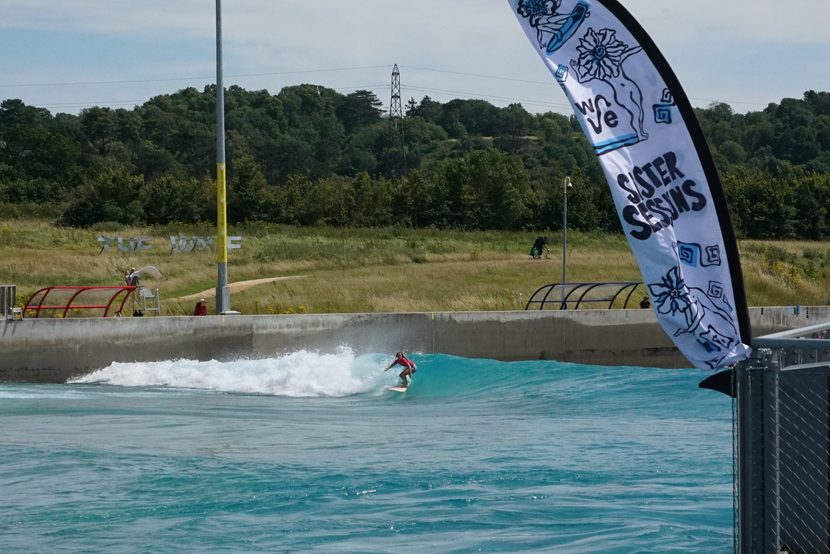 Woman surfing on Sister Session day