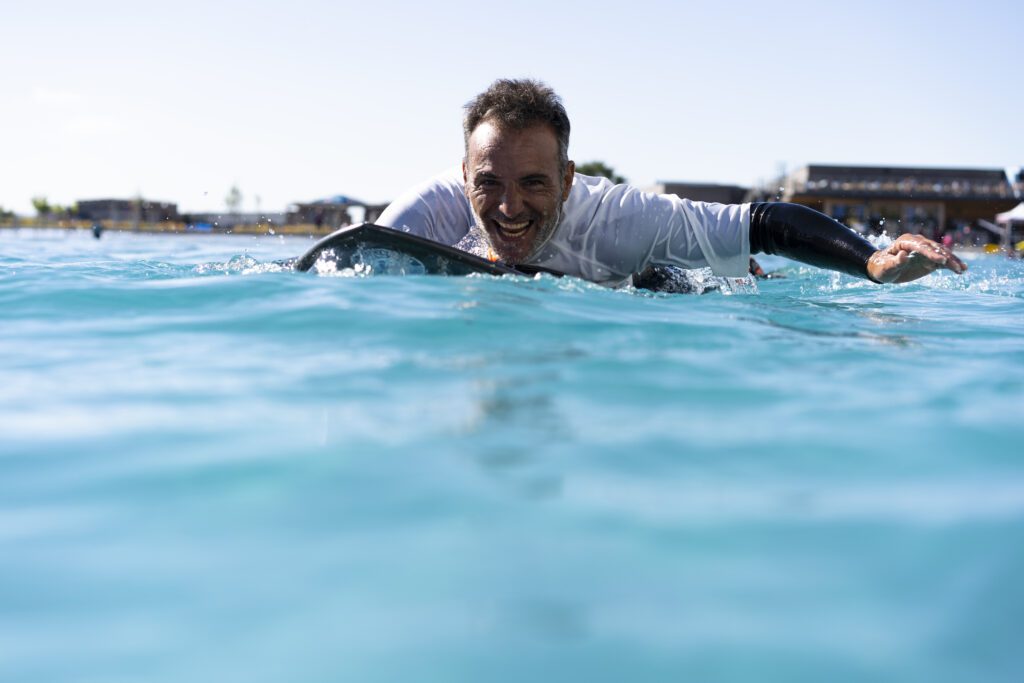 Adaptive surfer in the water at The Wave near Bristol