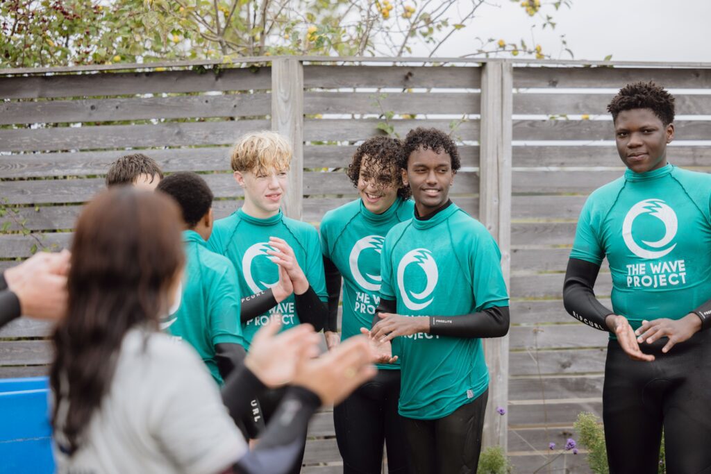 A group of surfers from The Wave Project get ready for their session at The Wave Bristol.