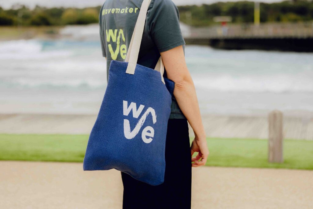 Someone wearing Wave canvas bag by shore at The Wave