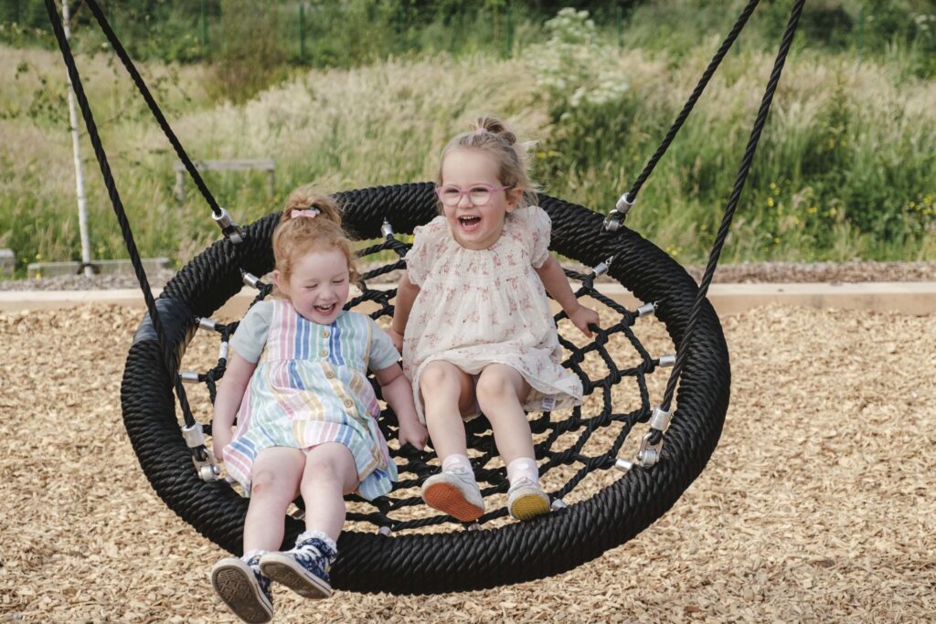 Children on swing at The Wave