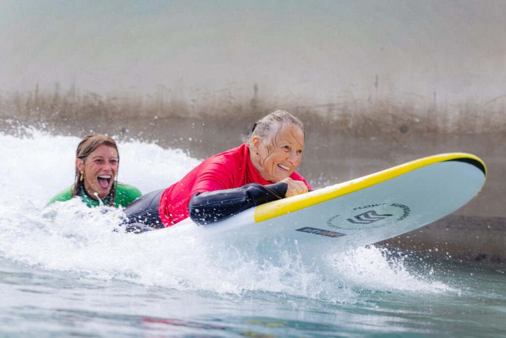 Rider using adaptive surf equipment at The Wave inland surf lake