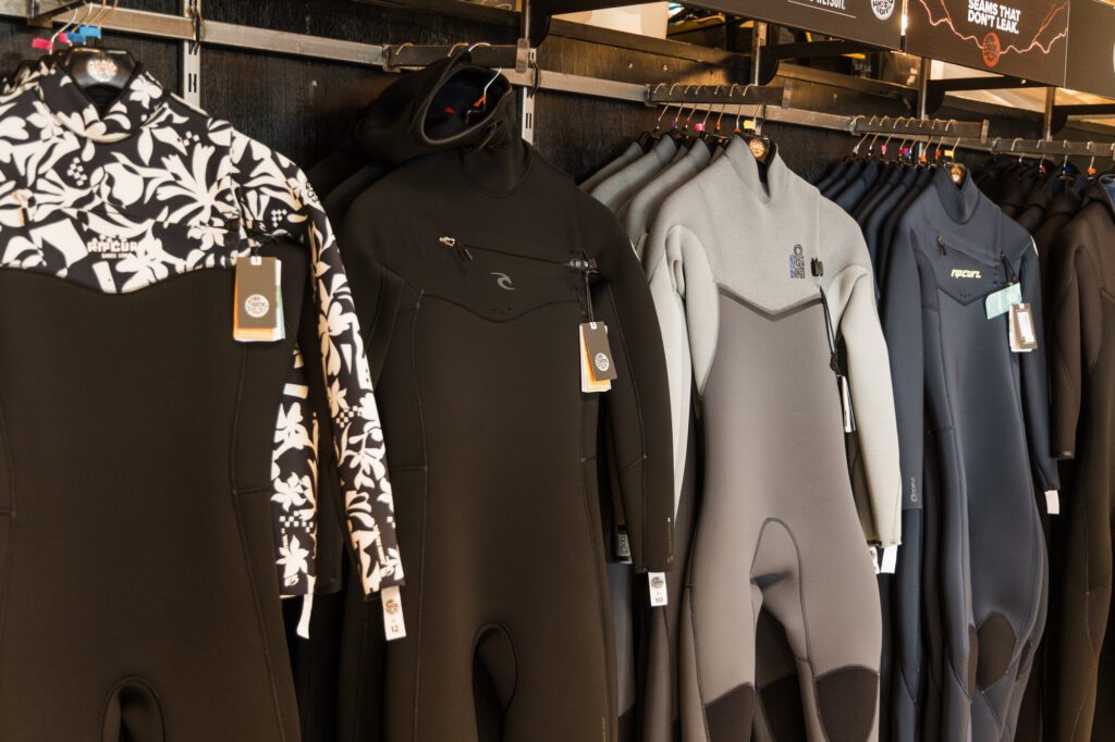 Selection of rip Curl wetsuits in the Boardroom at The Wave